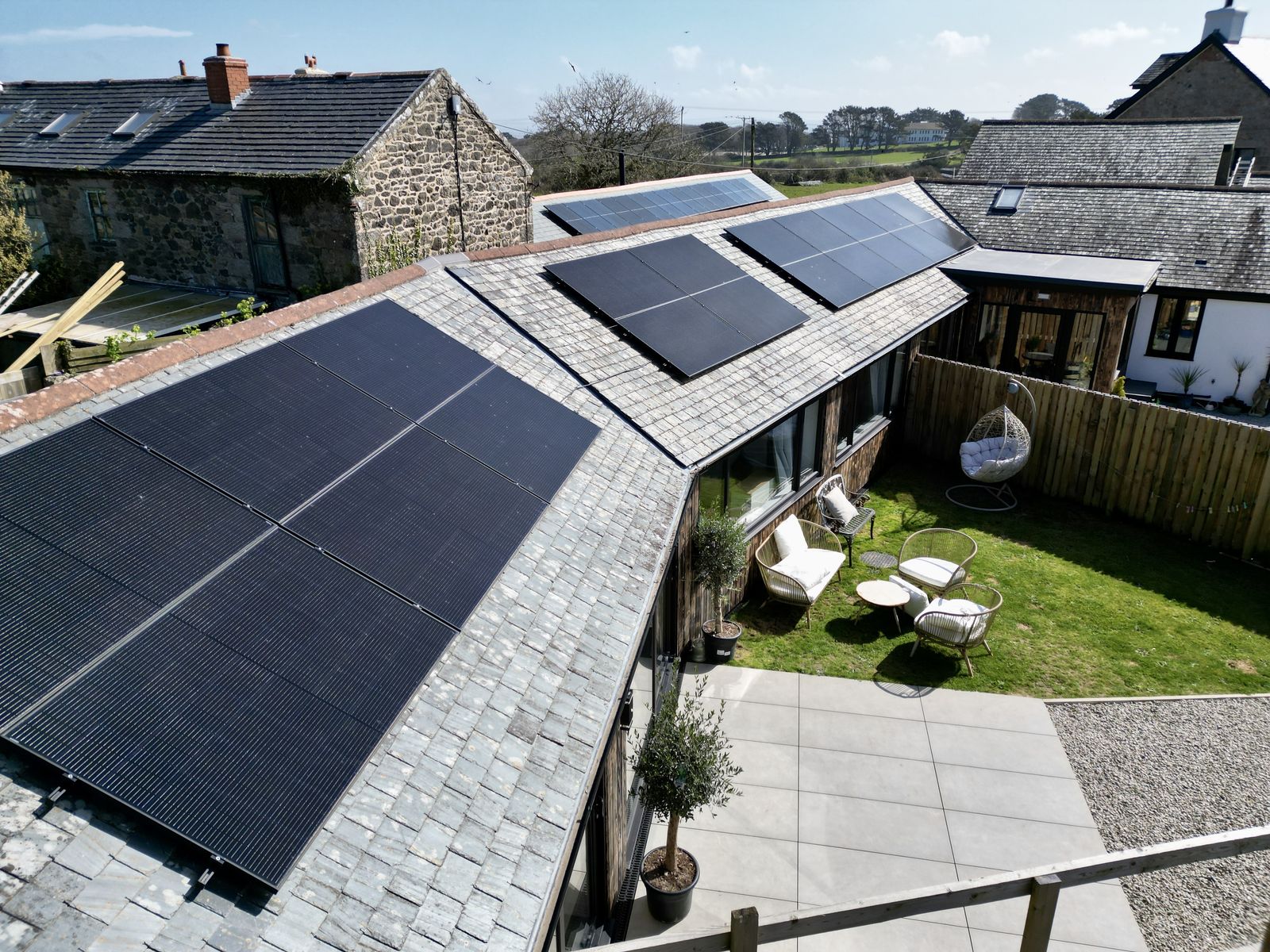 One of the three St Ives barn conversion homes, solar panels across the roof